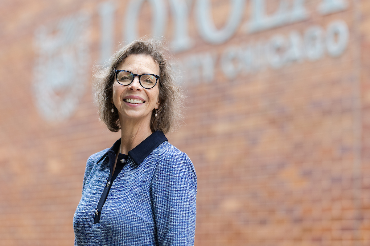 Dean Findley headshot outside Loyola University Chicago